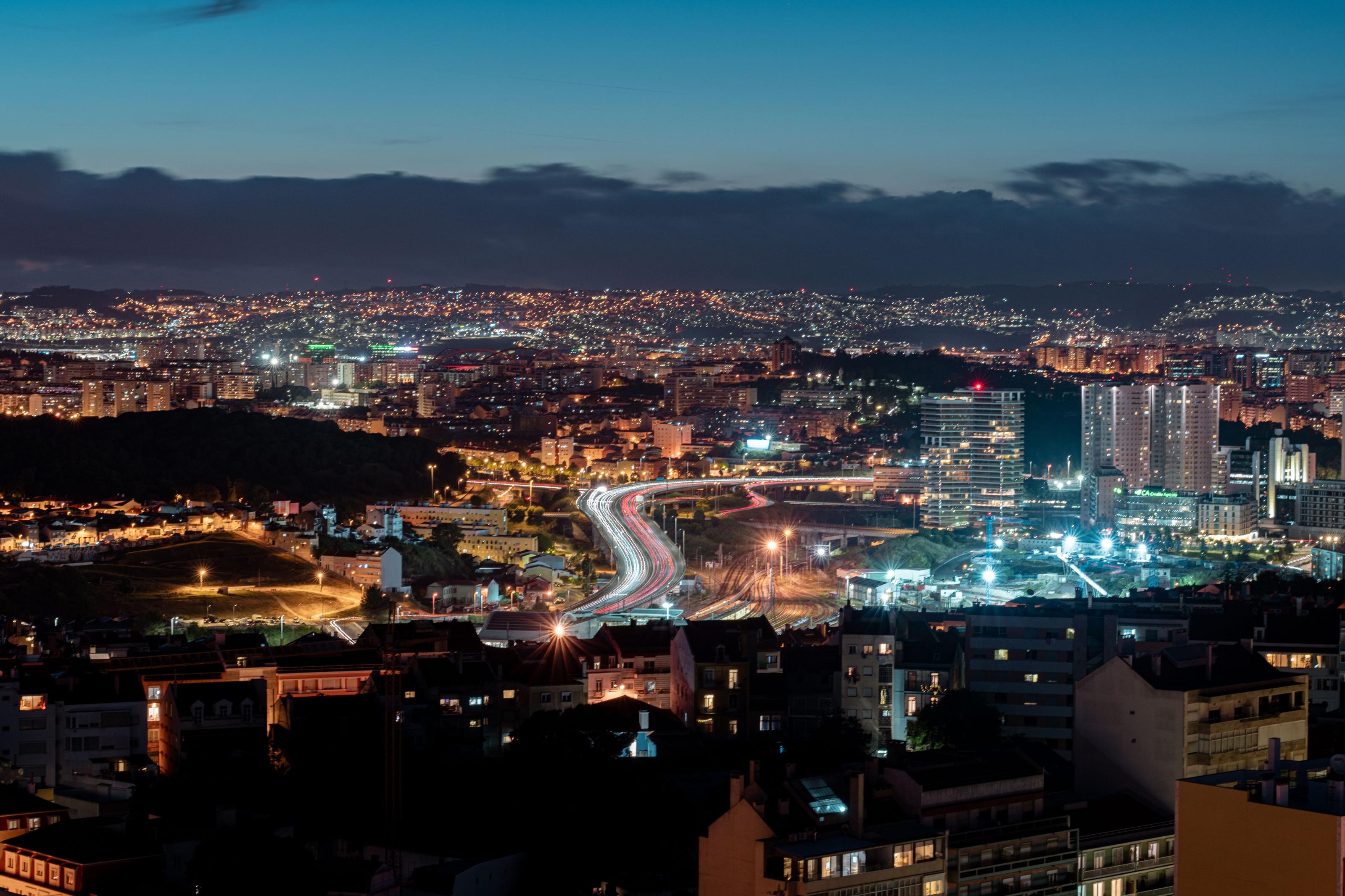 A Spanish city skyline at dusk, buildings dark during the April 2025 blackout