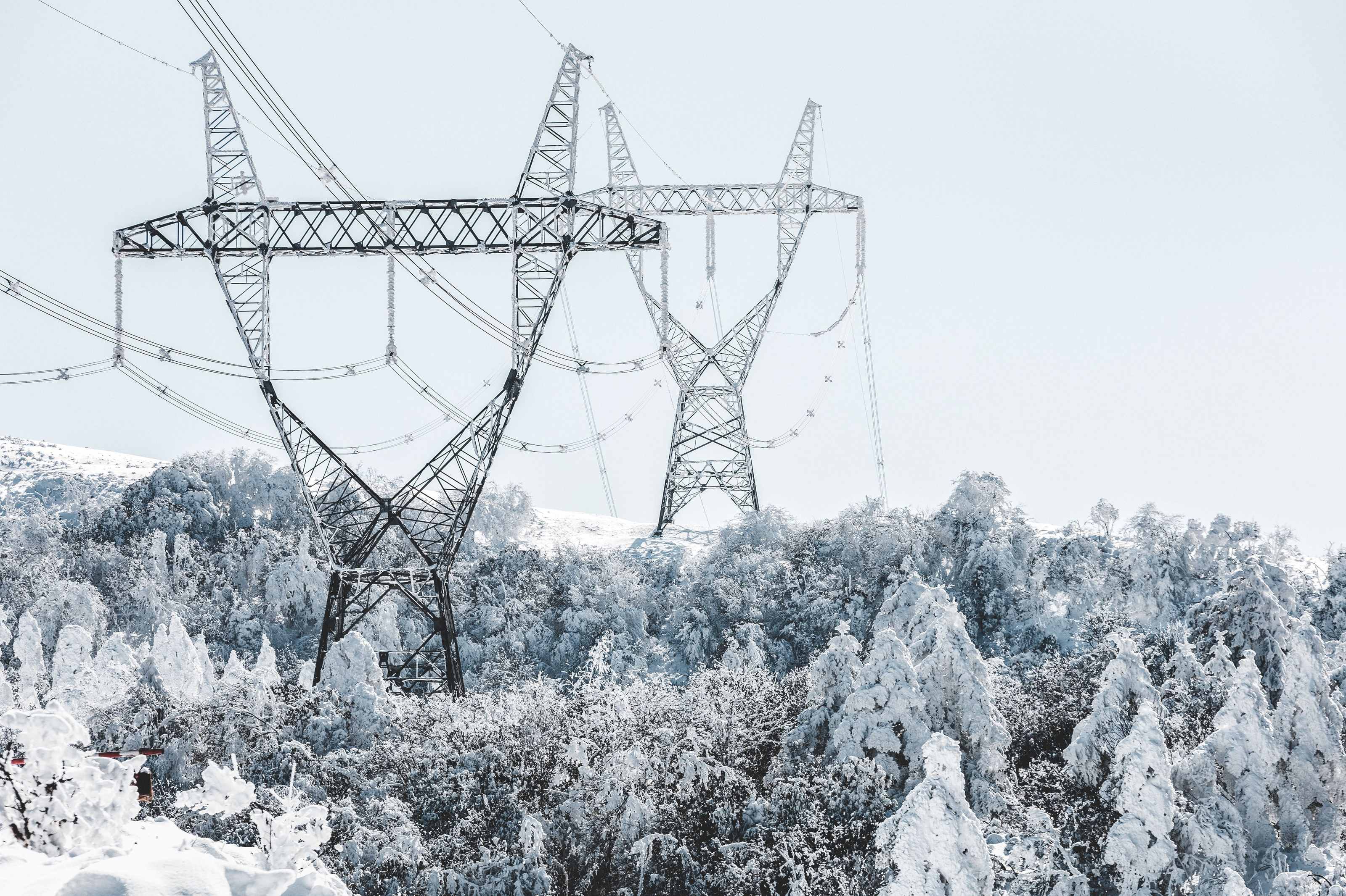 Snow and ice coating power lines during a Texas winter storm