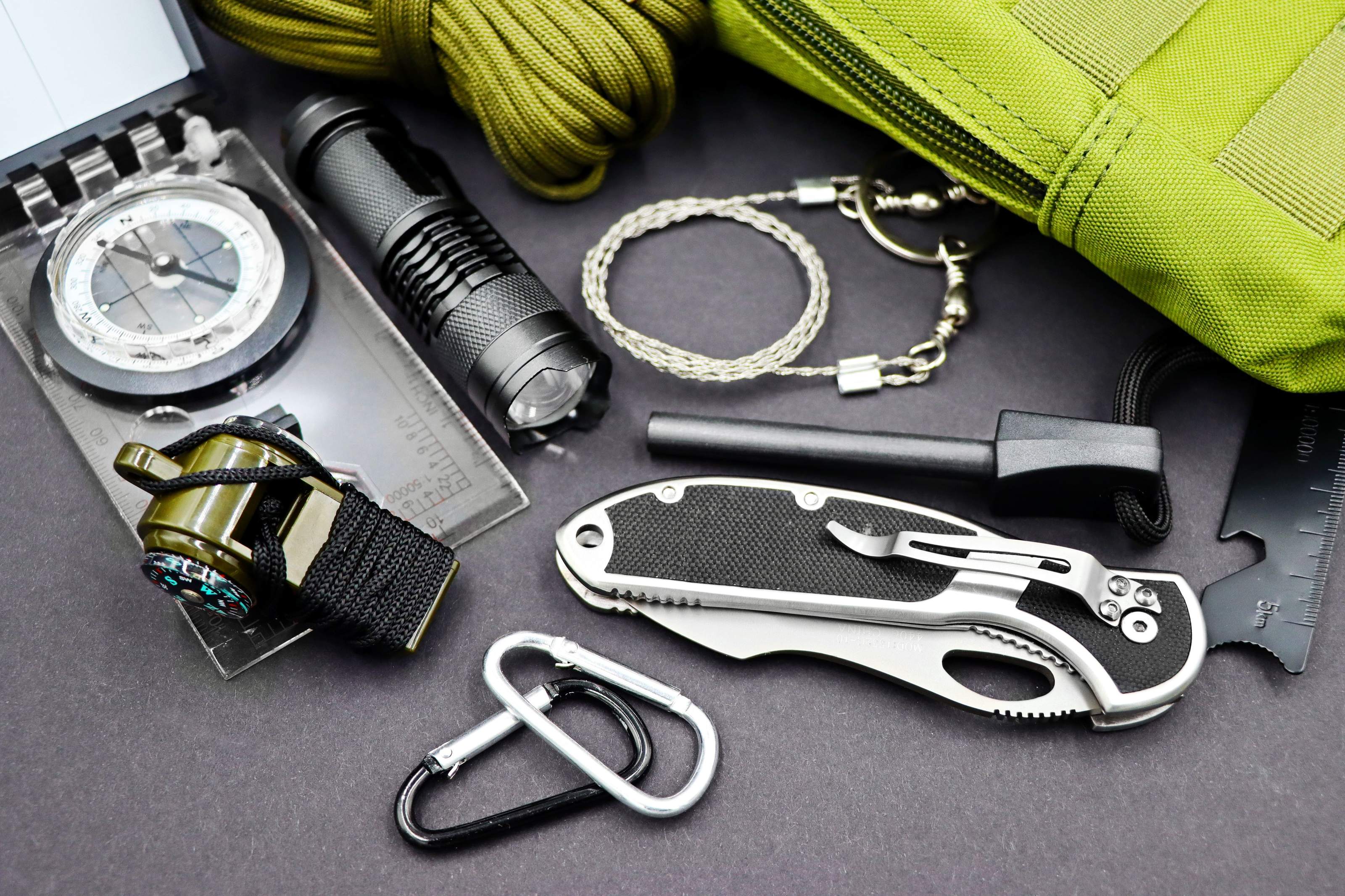 Portable power station and camping gear set up outdoors at an off-grid base camp