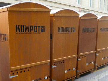 Compact composting toilets